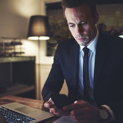 the-lawyer-browsing-his-phone-in-office.jpg
